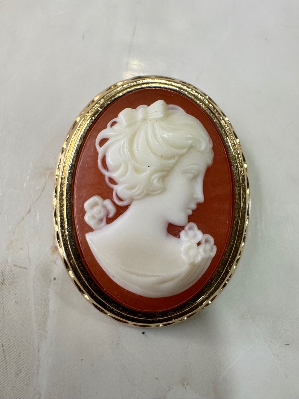 Vintage Cameo Brooch on Terracotta Background - Elegant Women’s Jewelry